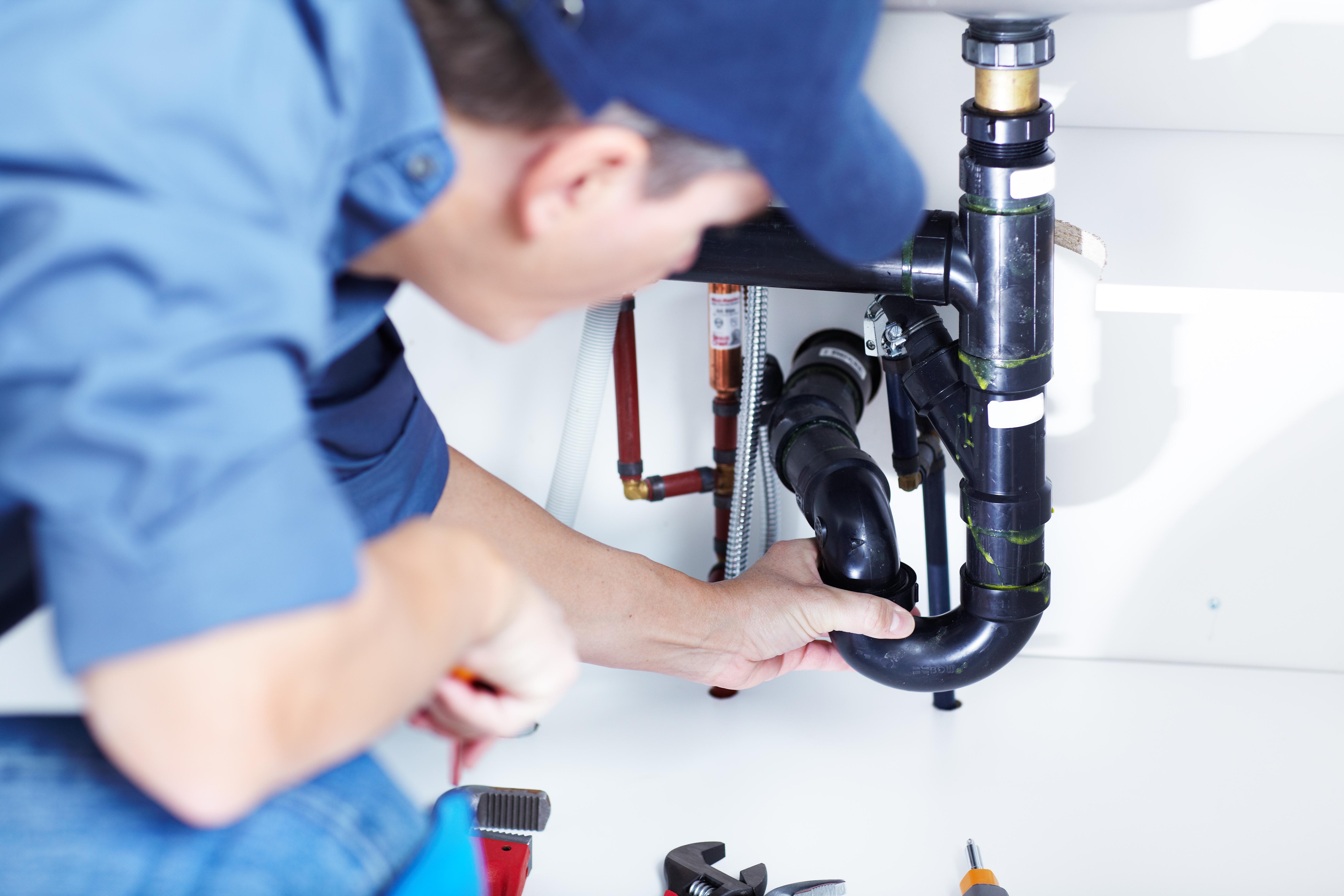 plumbers-fixing-drain