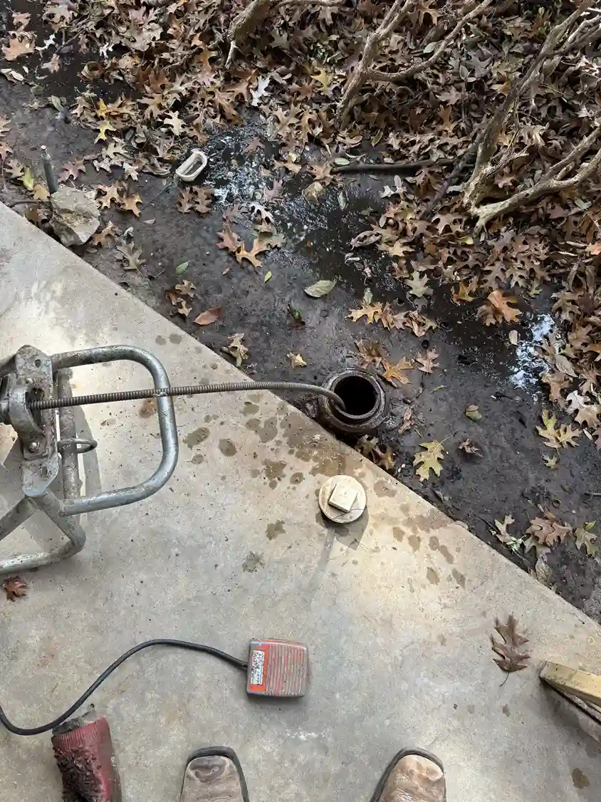 Sewer auger in outdoor cleanout