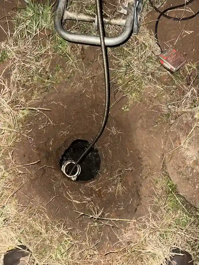 Drain auger clearing yard sewer line
