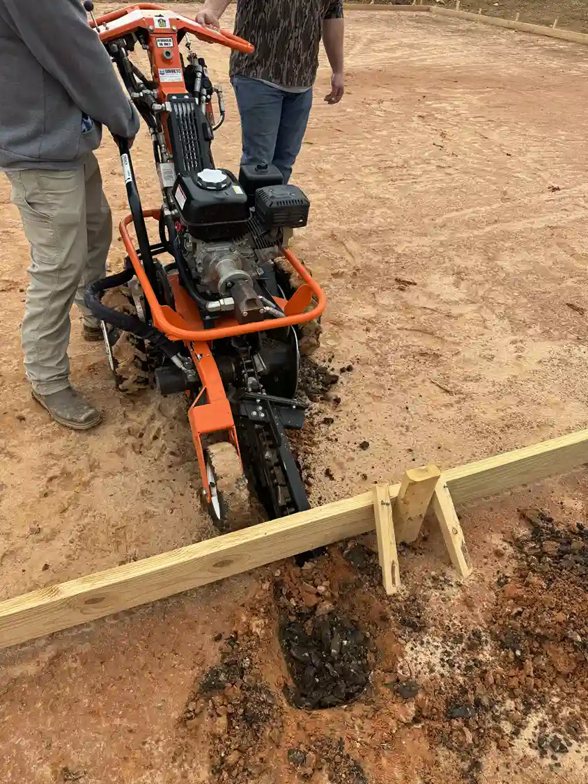 Trenching machine digging for utility line