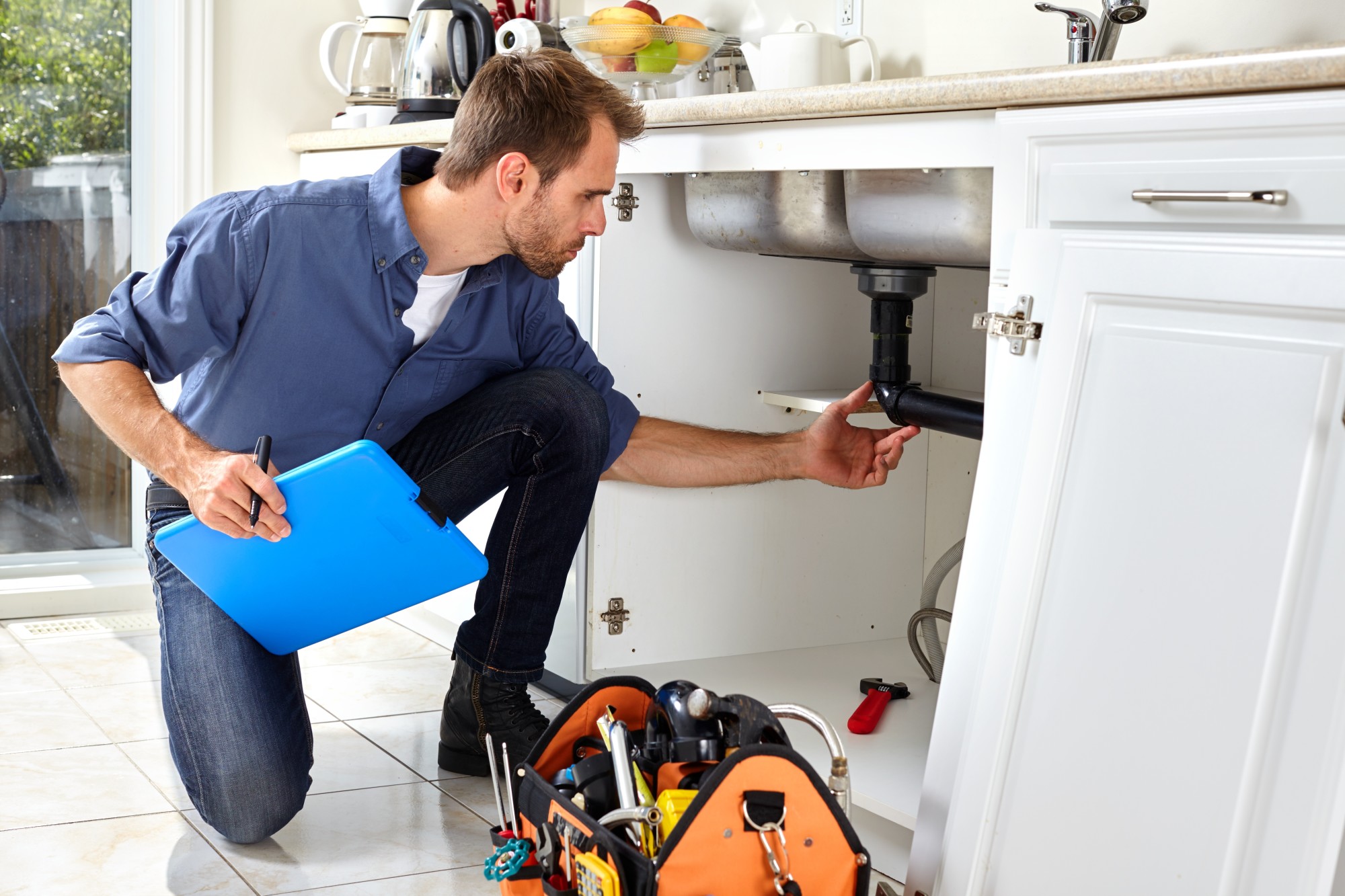 Emergency plumber checking a broken pipe