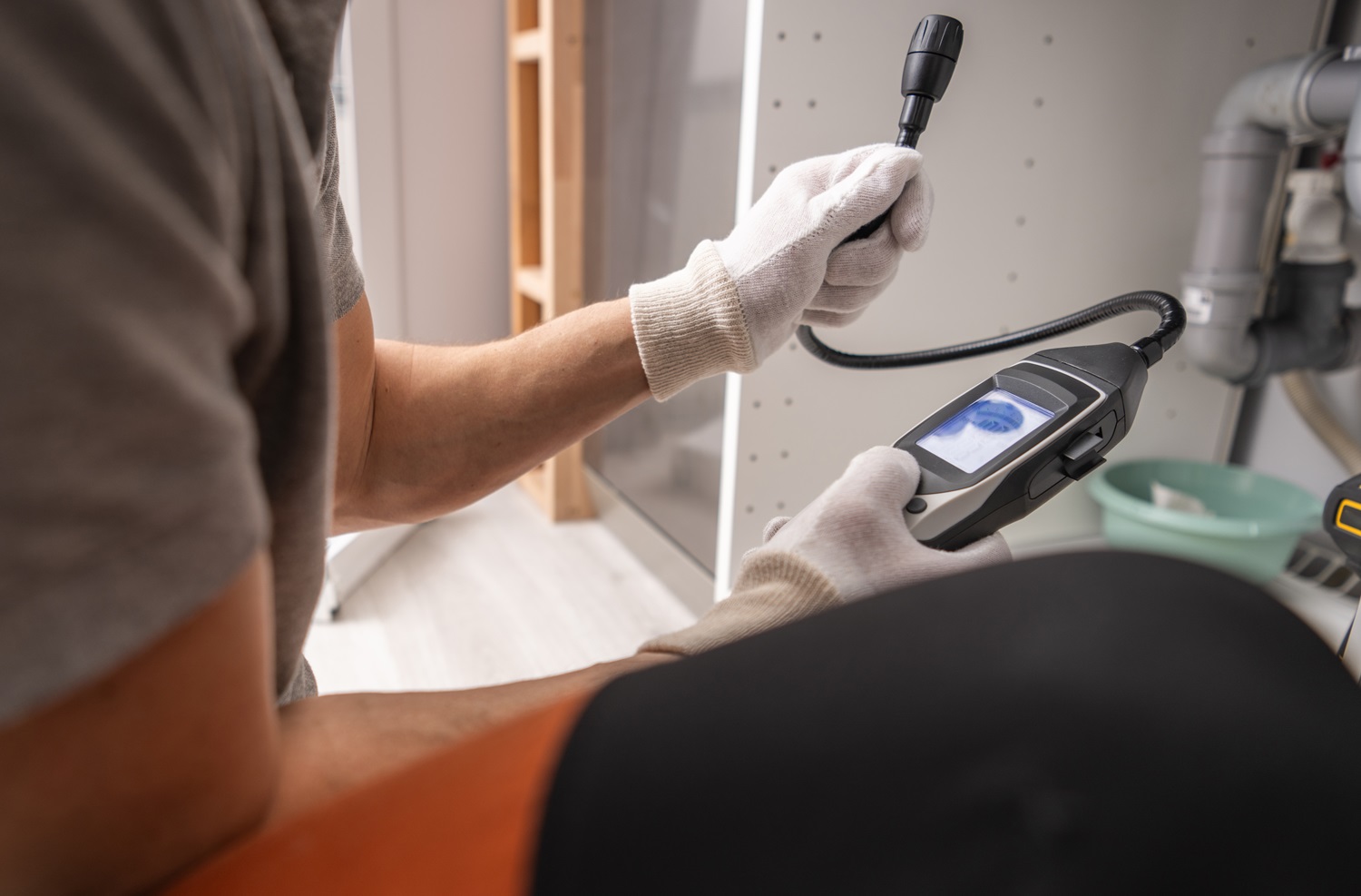 Technician with Gas Detector in His Hands