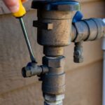 Home plumbing tools and pipes showing examples of improper DIY plumbing work that can lead to leaks, clogs, and costly repairs